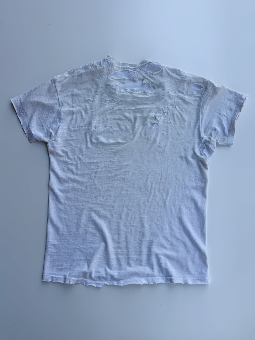 thoroughly repaired white t-shirt
