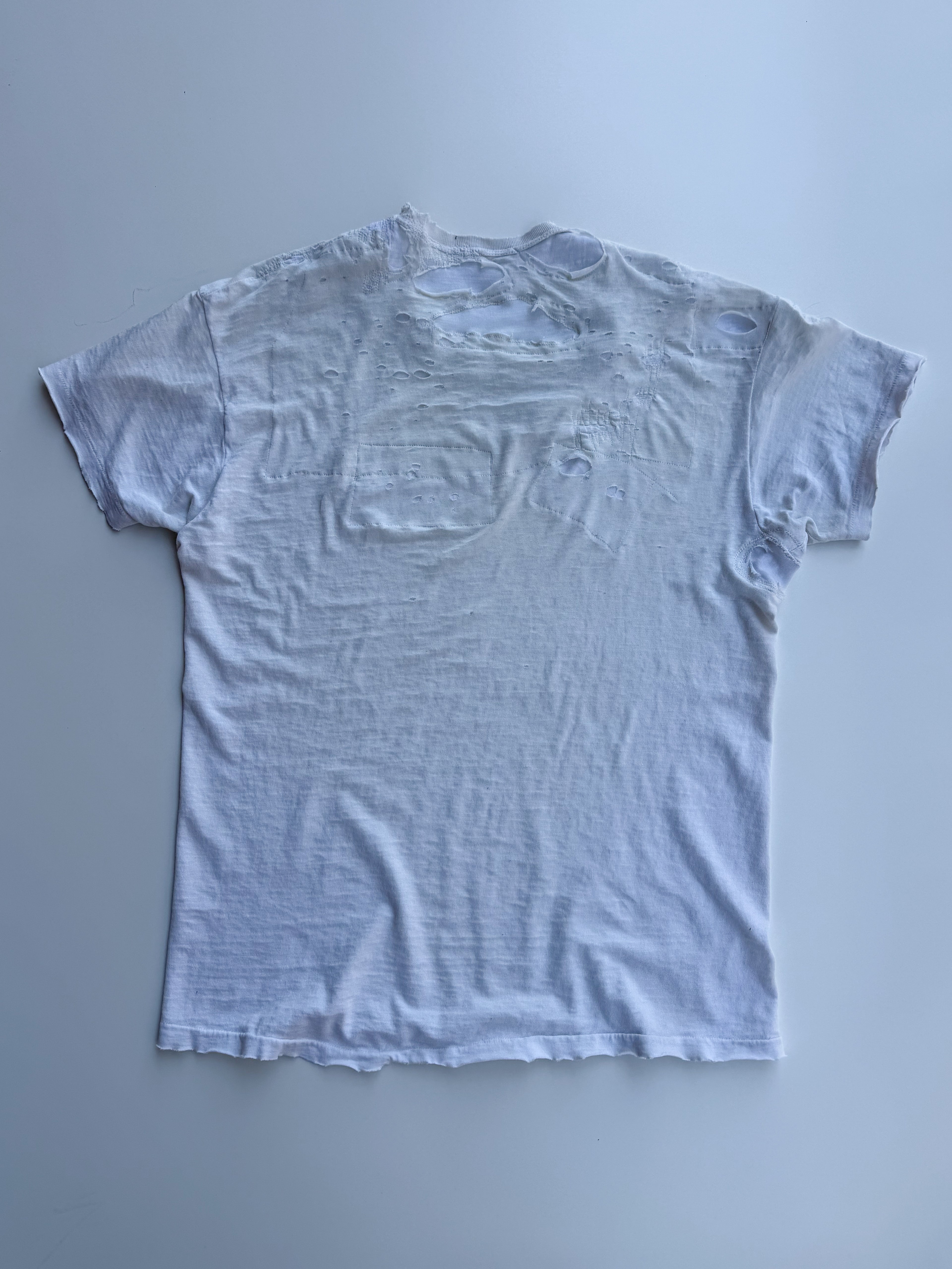thoroughly repaired white t-shirt