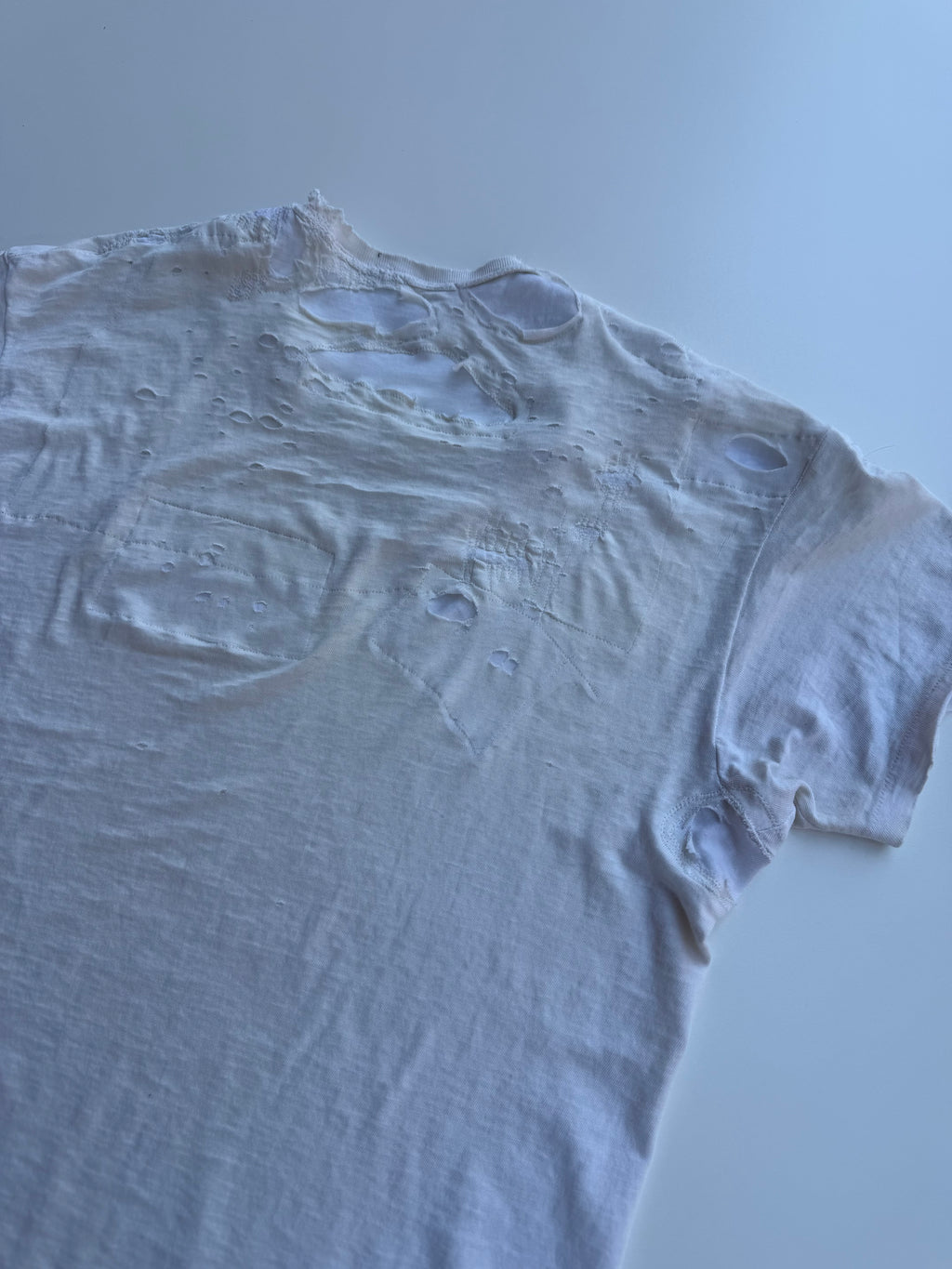 thoroughly repaired white t-shirt