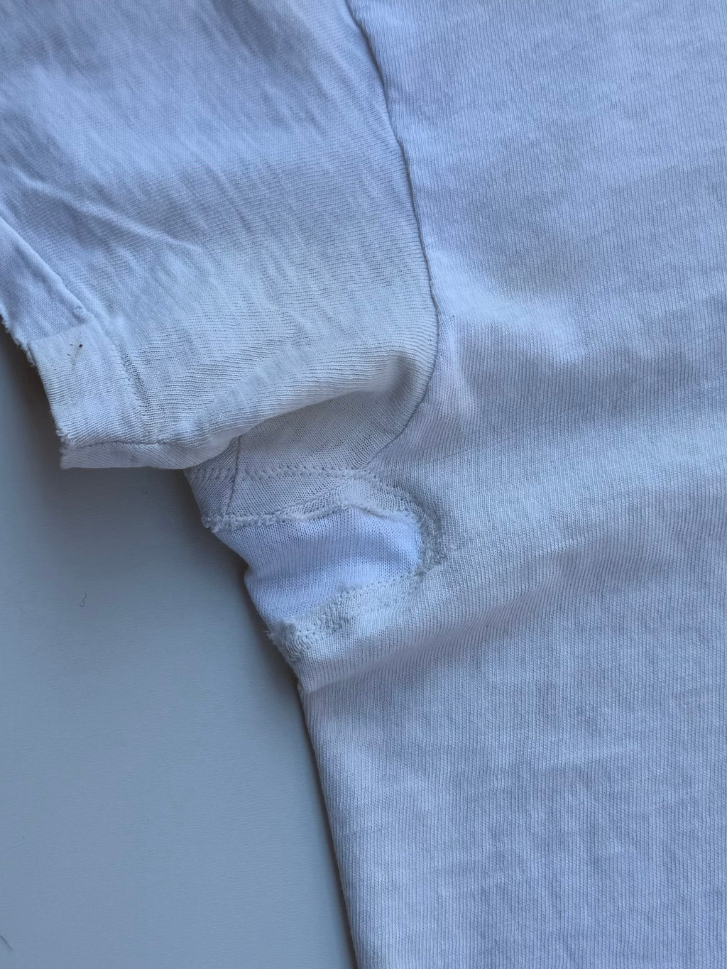 thoroughly repaired white t-shirt