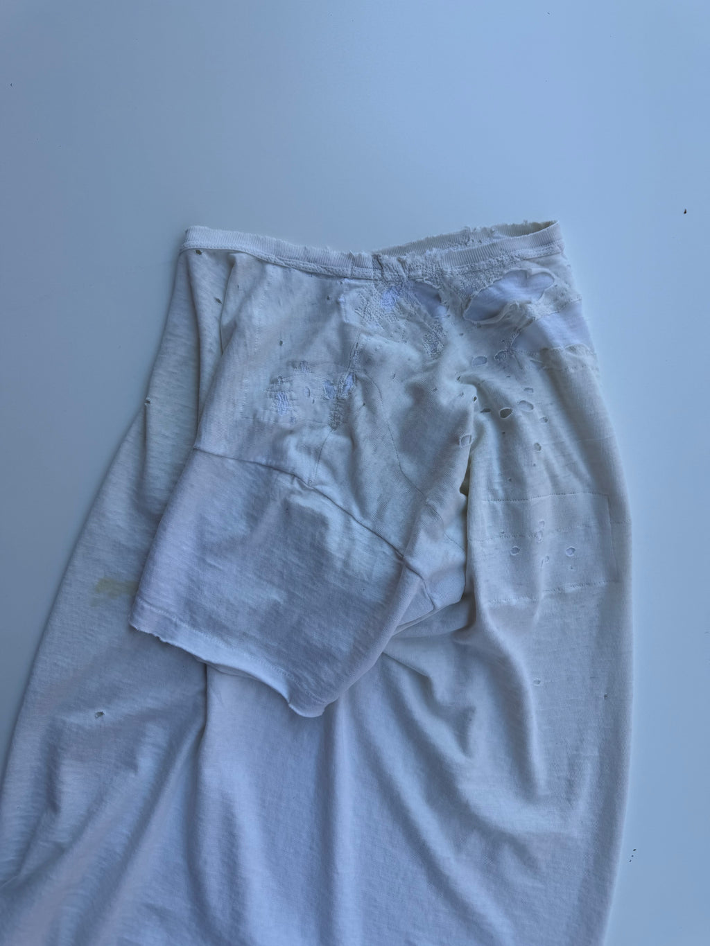 thoroughly repaired white t-shirt