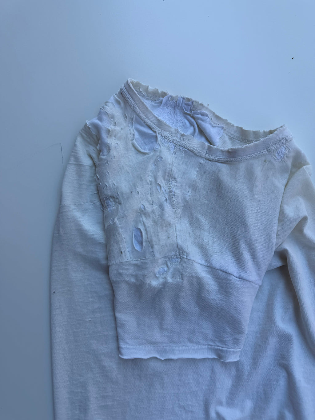 thoroughly repaired white t-shirt