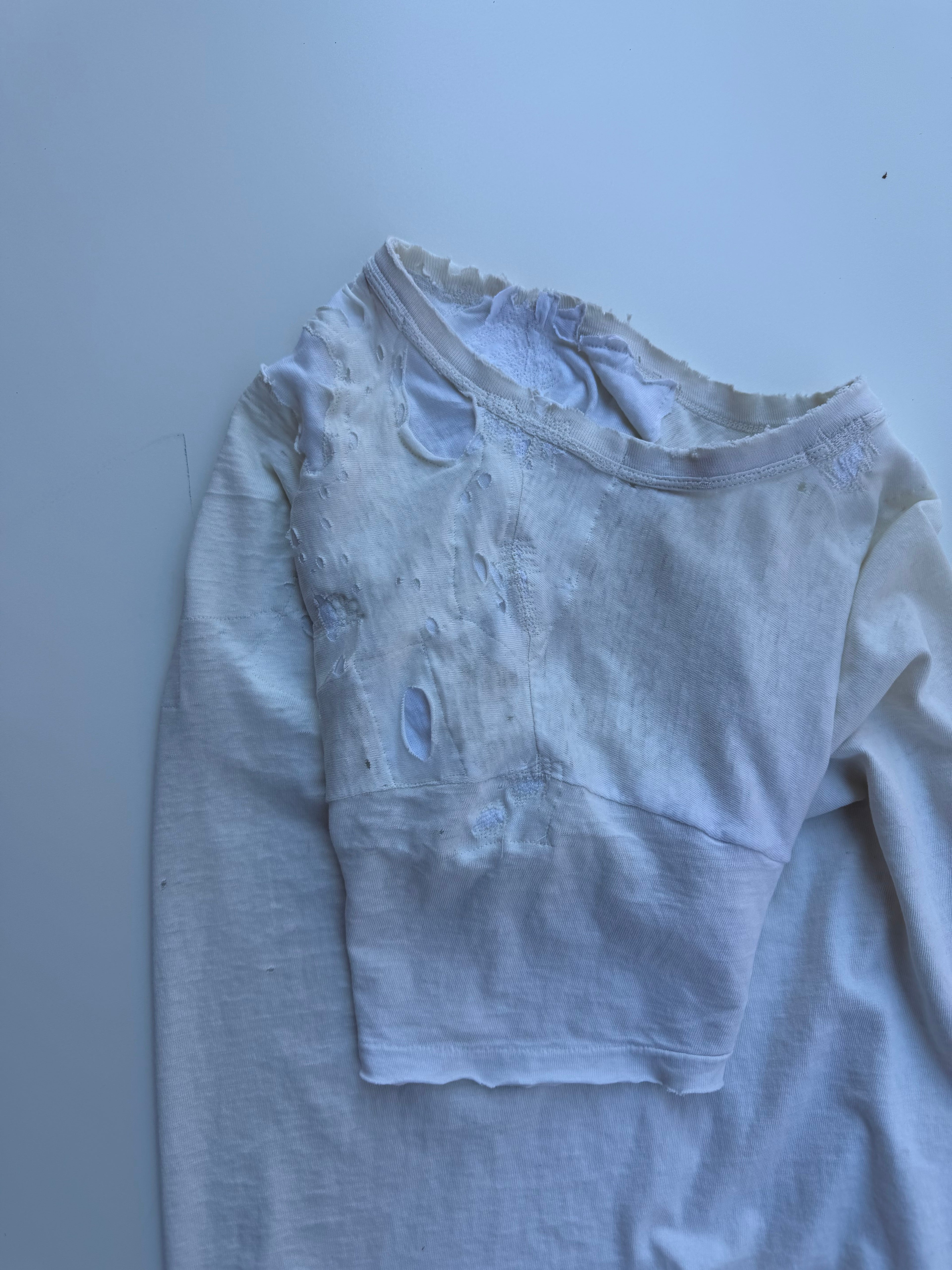 thoroughly repaired white t-shirt