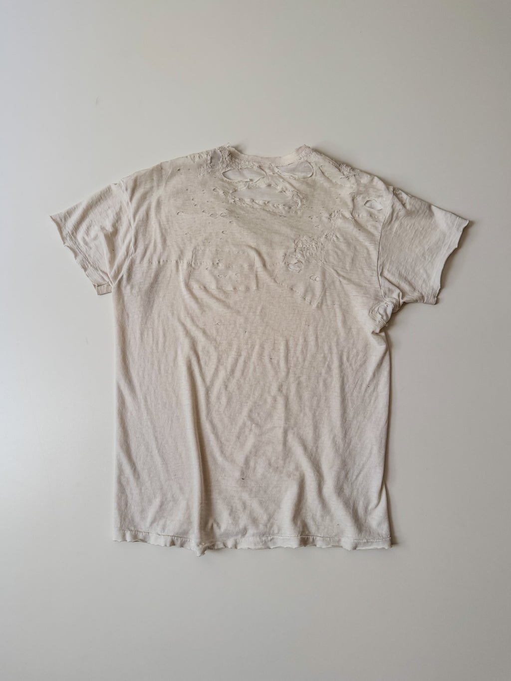 thoroughly repaired white t-shirt