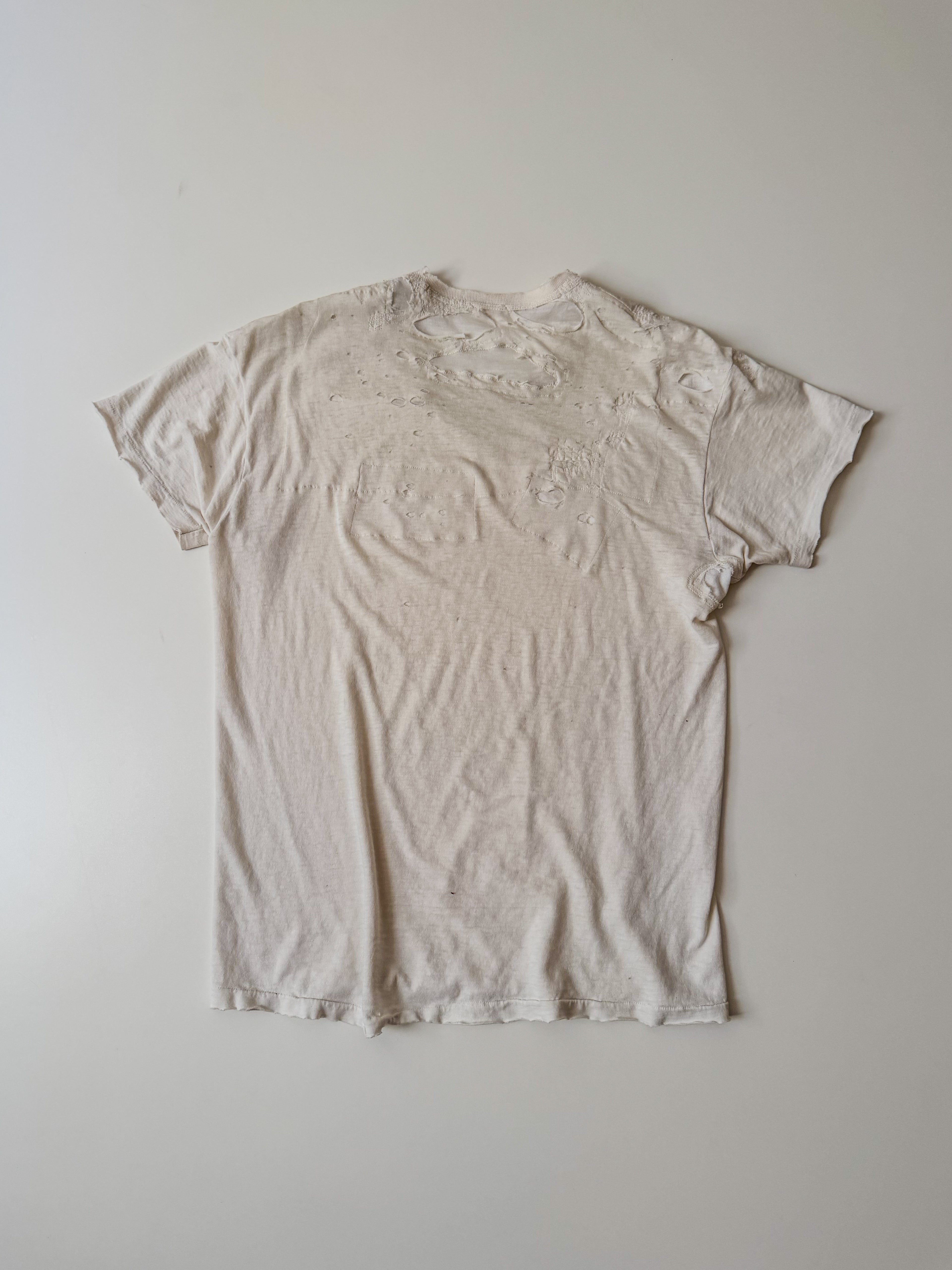 thoroughly repaired white t-shirt